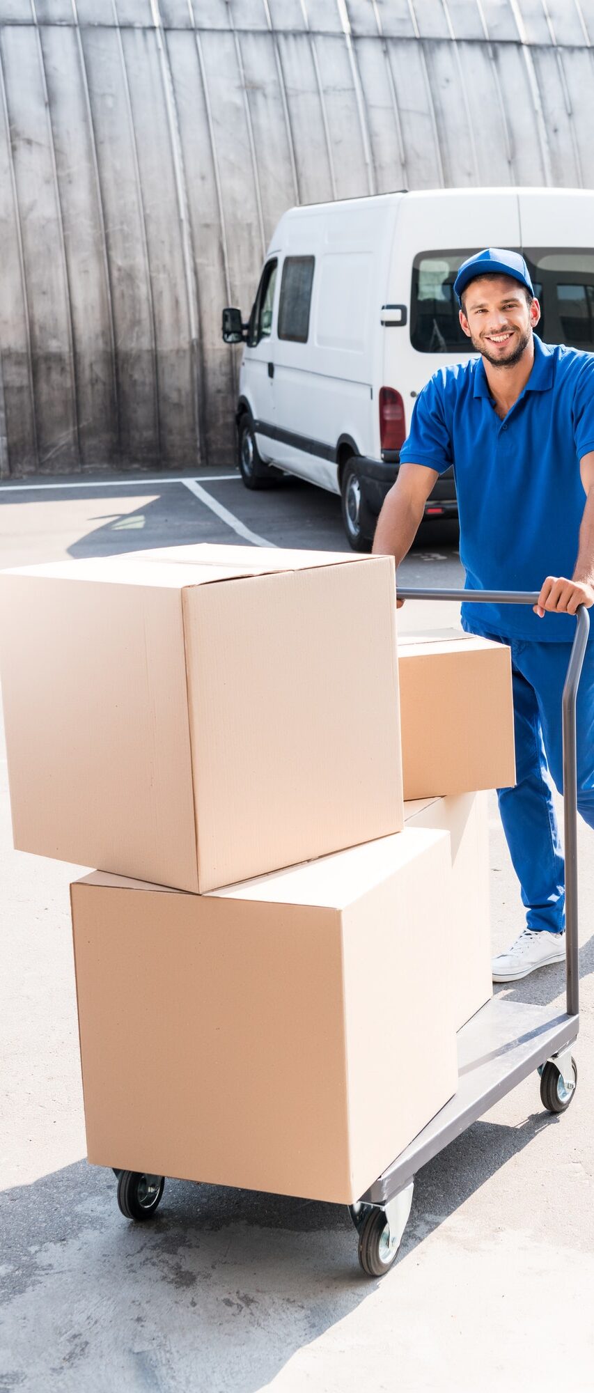 happy-delivery-man-with-cardboard-boxes-on-cart.jpg